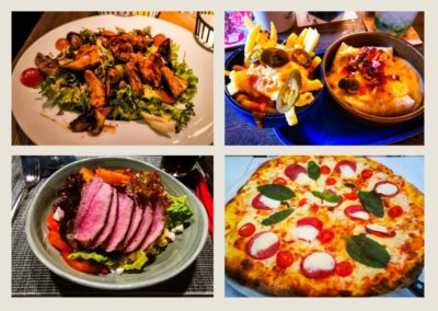 Eine Collage aus vier Gerichten des Lieblingsrestaurants Ulm: Gegrillter Hähnchensalat, Pommes frites mit Käse und Jalapeños, eine Schüssel Steak Ulm auf Grünzeug und eine Pizza Margherita mit Basilikum, Tomaten und Mozzarella.